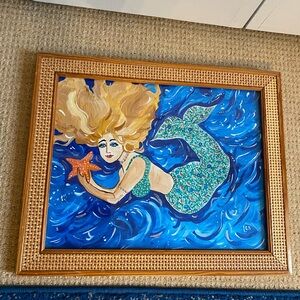 Hand painted mermaid framed in rattan